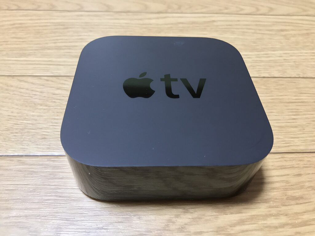 Apple TV 4K box top view with Apple logo (earlier model shown)