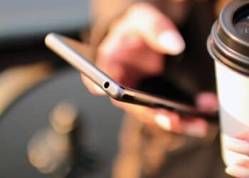 Diwali scams 2026: person checking messages on a smartphone