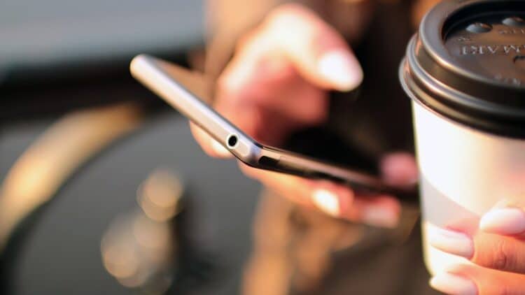 Diwali scams 2026: person checking messages on a smartphone