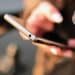 Diwali scams 2026: person checking messages on a smartphone