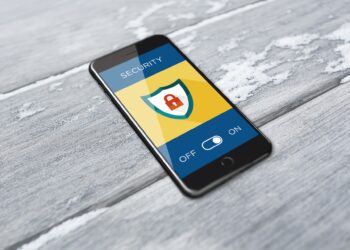 A person using an Android smartphone, illustrating fake APK fraud in India