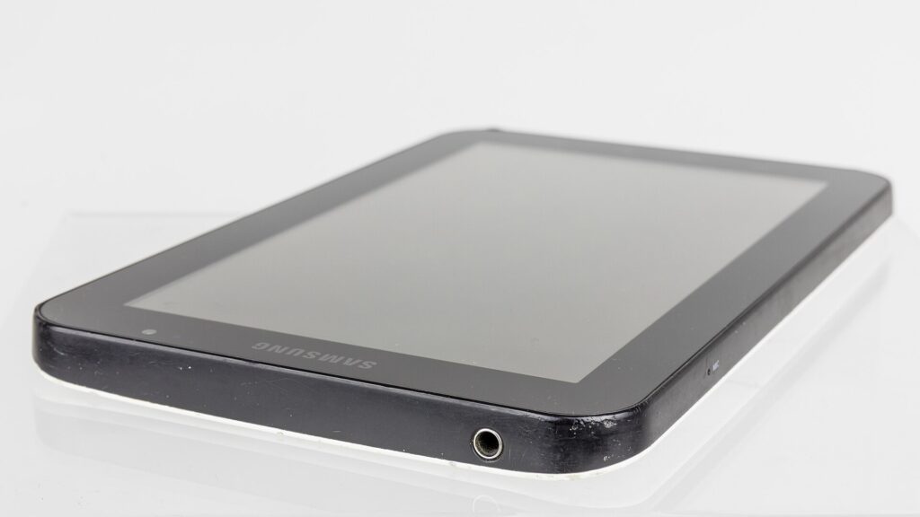 Person drawing on a tablet with a stylus
