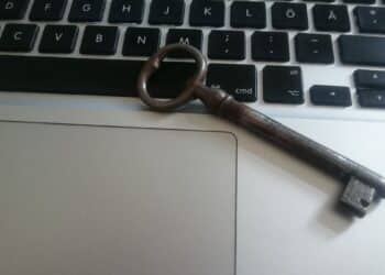 WordPress site hacked recovery: an old key resting on a laptop keyboard